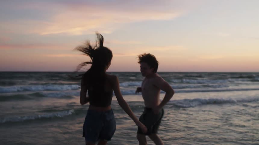 A couple hug at a beach