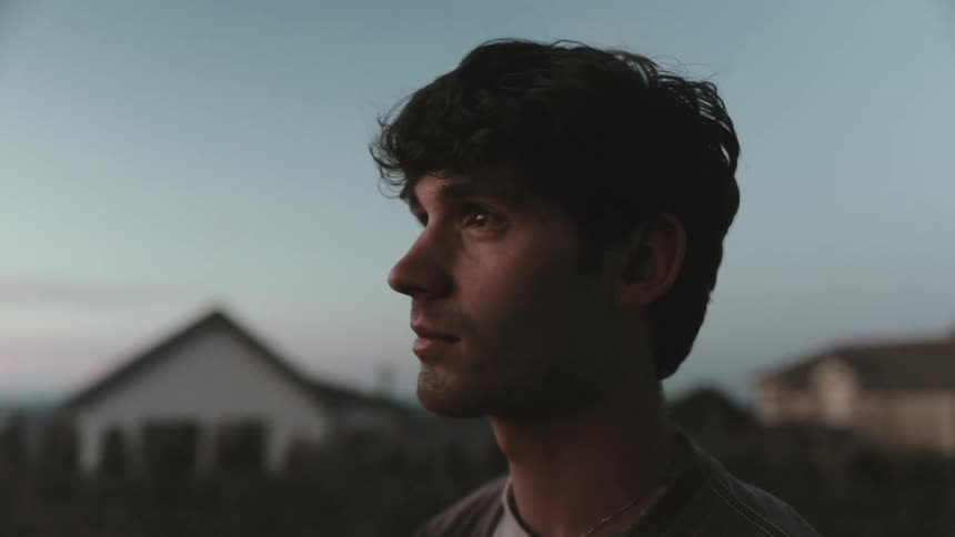 A man looks away from the camera