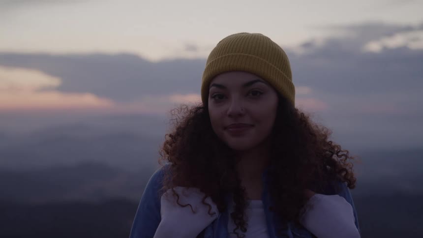 A woman looks at the camera