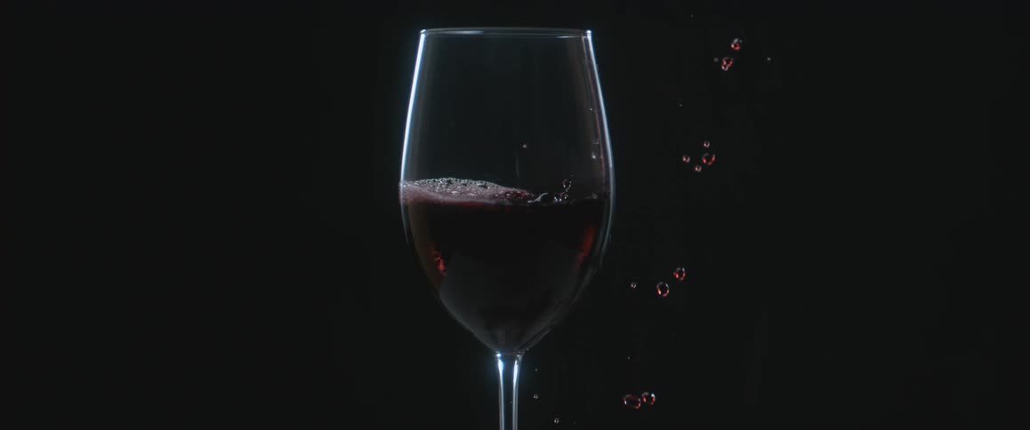 Wine is poured into a stemmed glass