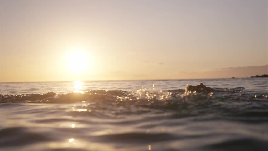 A man swims in the ocean