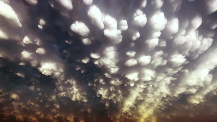 Sky landscape with clouds and changing colors of sun rays