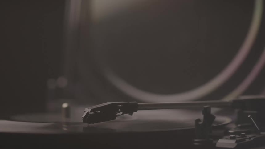 Close up of a playing vinyl record disc in a room