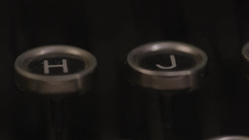 A couple round black buttons with silver lining and emblems
