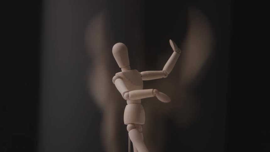 The figurine of a person is turning