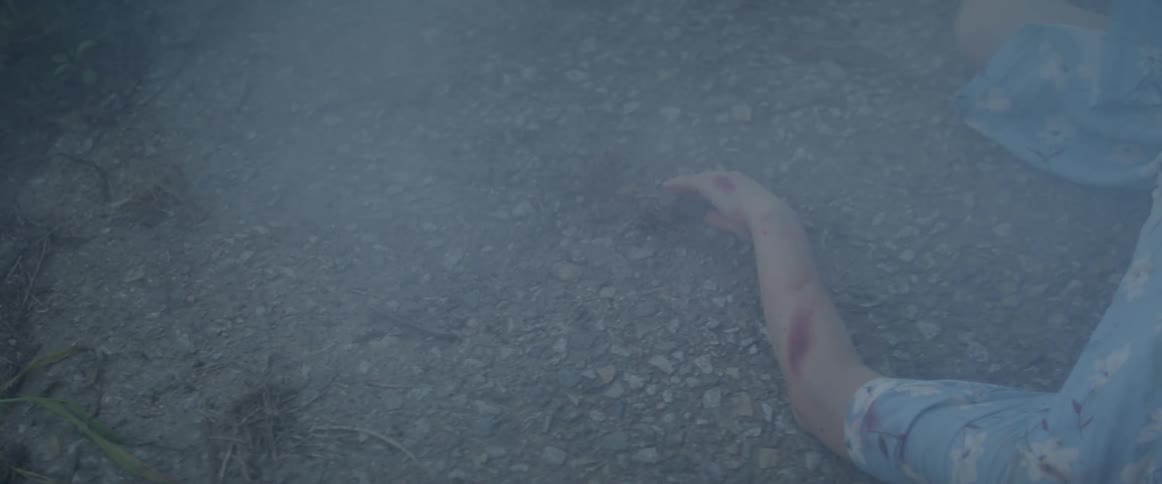 Smoke is moving over a person on the ground