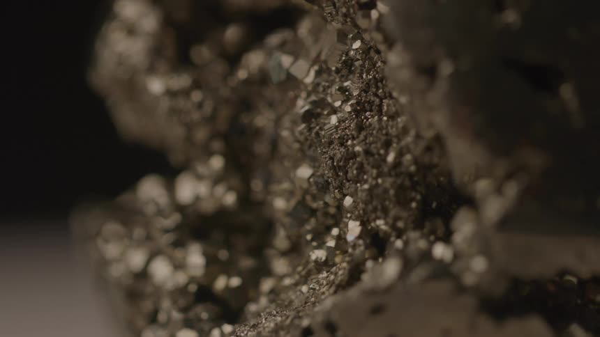 Closeup of a stone with wear and metallic formations