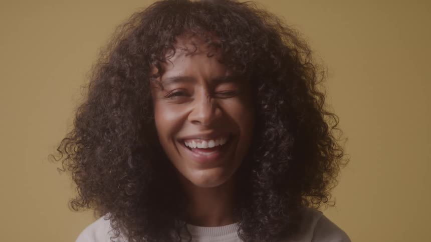 Woman with curly hair smiling