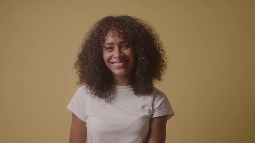 A woman winks and laughs