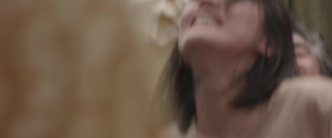 A woman struggles to get away from someone