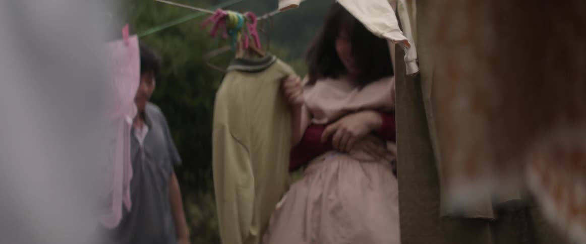 A man drags a woman away kicking and screaming