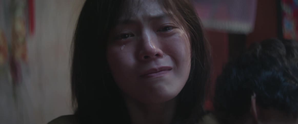 A woman cries as a man is sexually assaulting her