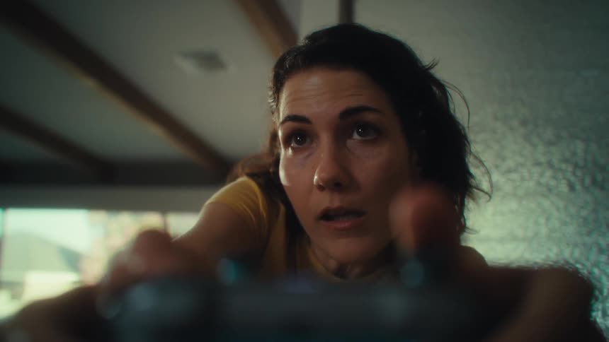 Point of view woman playing video game then jumping in excitement after winning