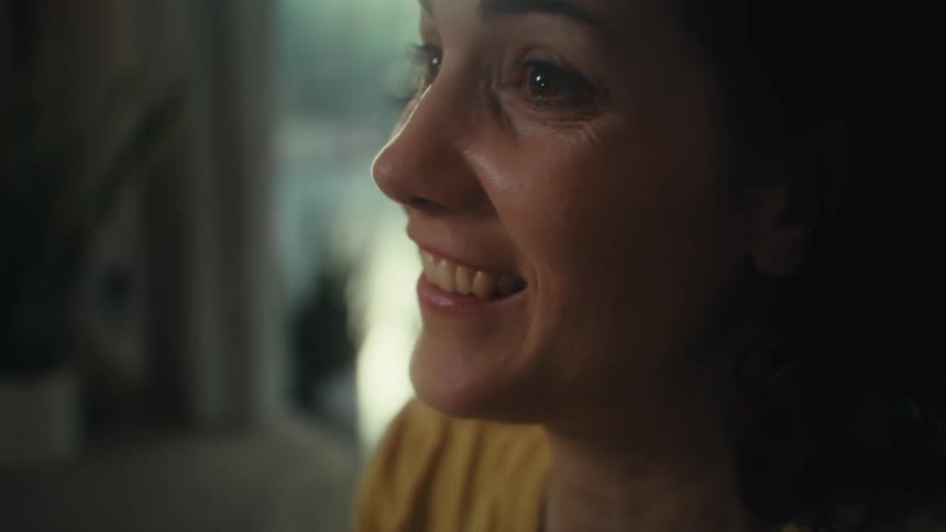 Woman smiling with a joyful expression