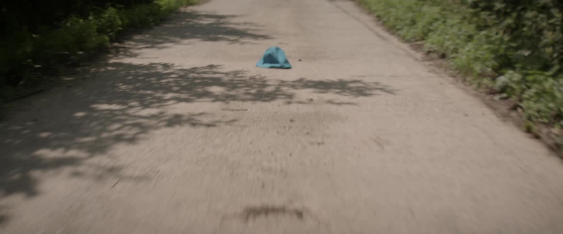 A hat falls on the ground of this trail
