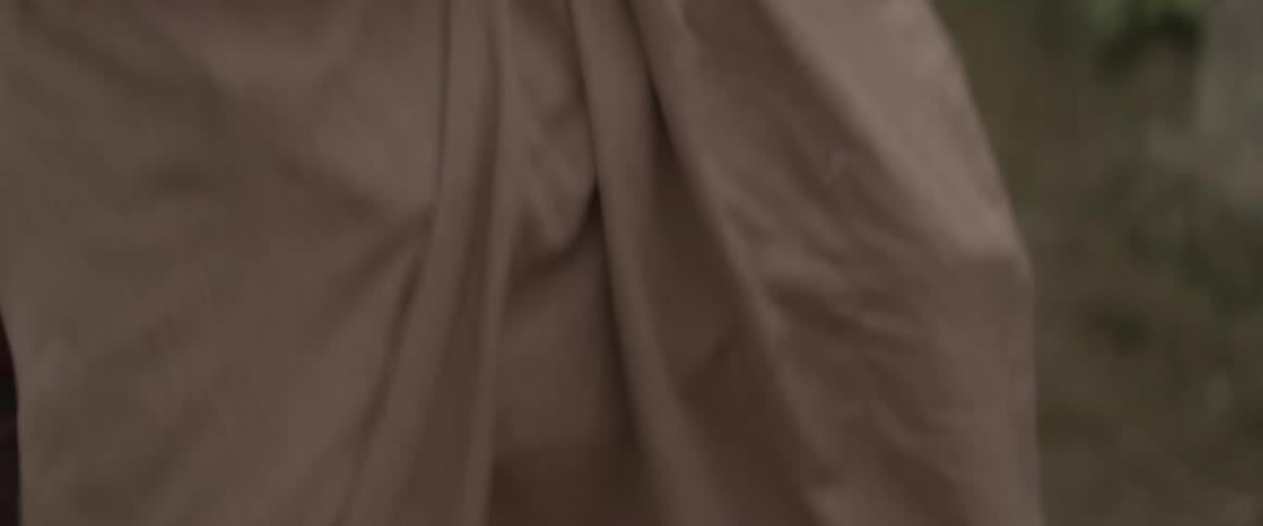 A close up view of somebody grabbing someone else
