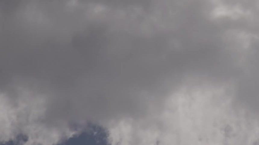 The clouds pass by fast