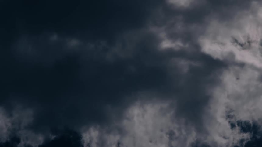 The sky gradually darkens as stormy weather approaches at midday