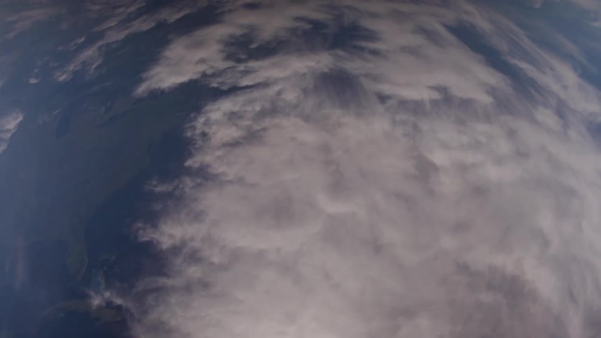 Aerial above clouds in the sky during daytime