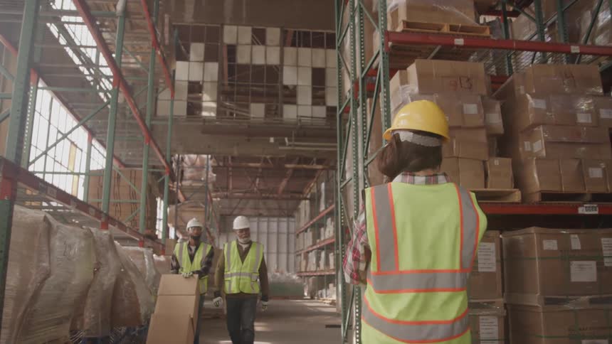 Workers nod at each other as they walk past