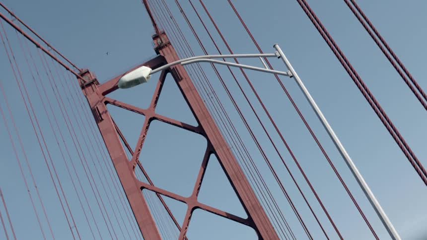 A tall bridge has many long wires