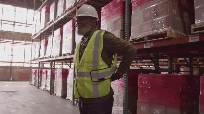 A warehouse worker stretches