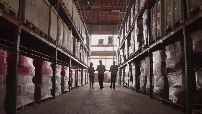 Employees walk together down the hall