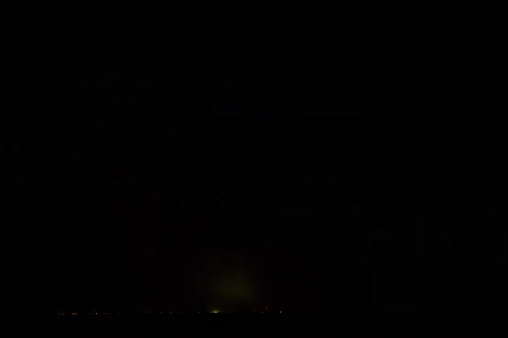 Thunder continues to light up the clouds at night signaling approaching rain