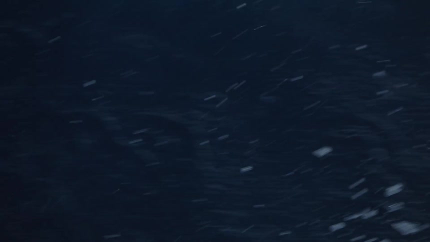An ocean view with waves crashing and creating splashes at midday