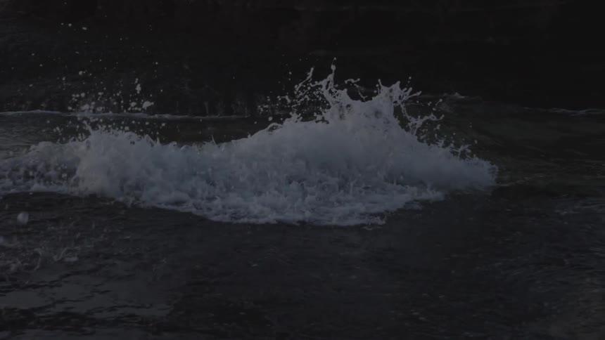 Water flows into a rocky crevice