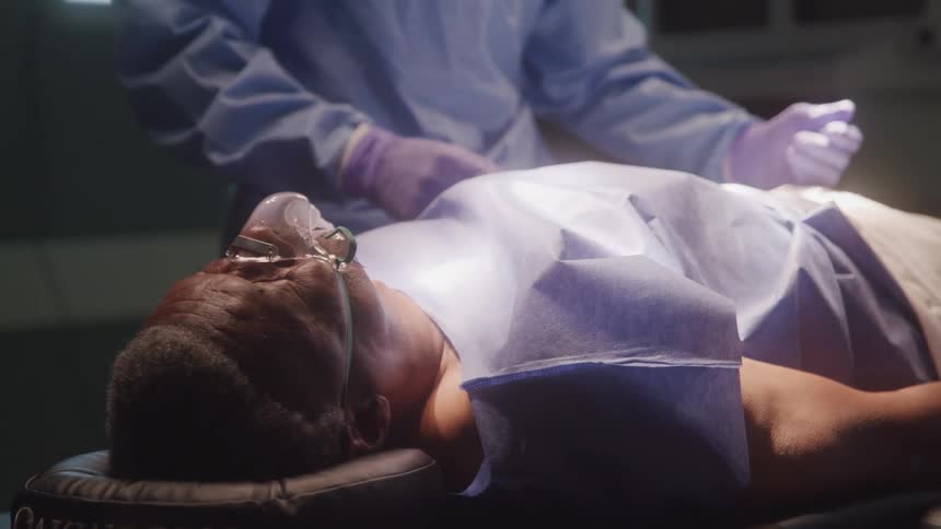 Male patient laying on surgery table having surgery