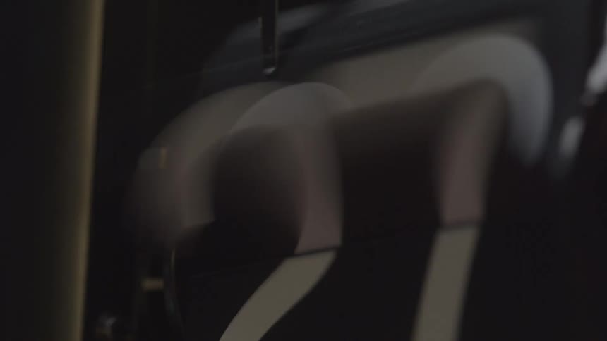 A close view of a flip clock shows the number on the minutes display changing