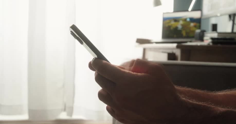 A man is texting fast on his cell phone
