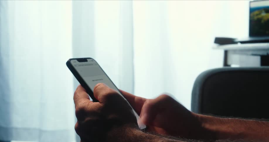 A man is texting on his cell phone