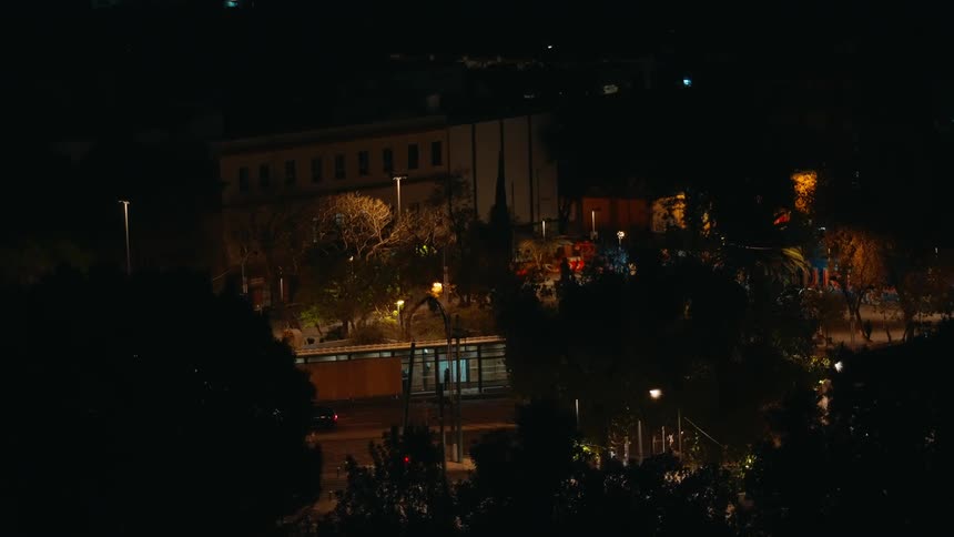 Night view of an urban area lit by streetlights and building lights