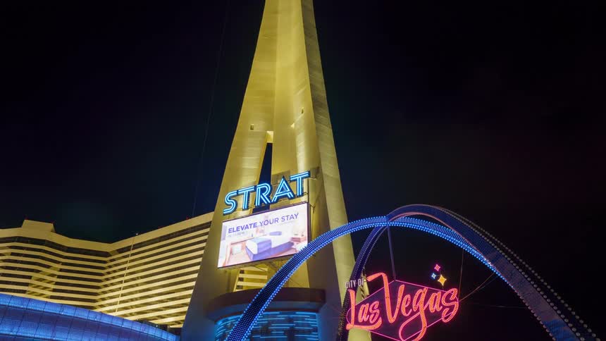 Illuminated facade of the strat hotel in las vegas at night