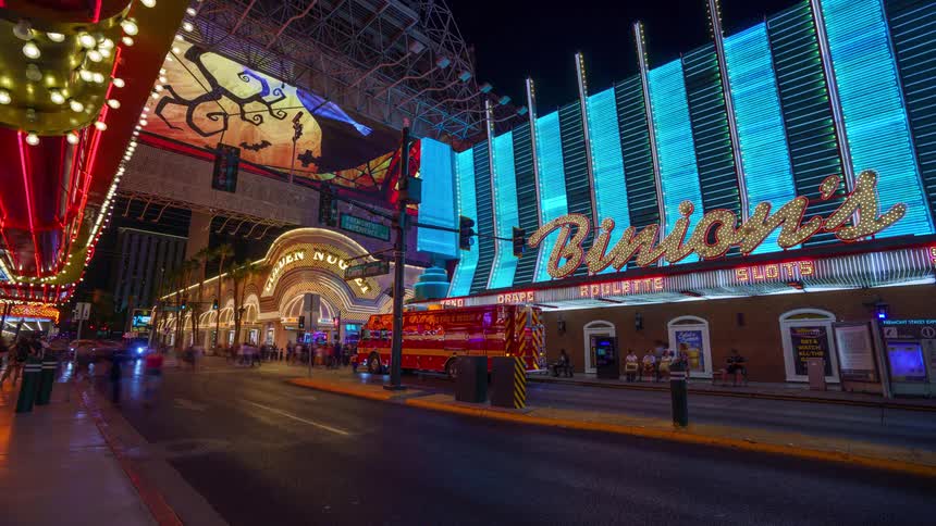 Busy las vegas street with vehicle and pedestrian traffic