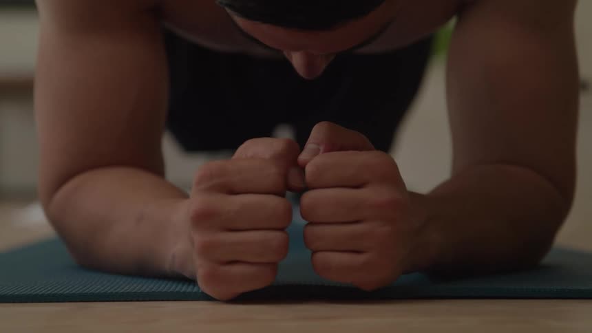 Man performing a plank on an exercise mat