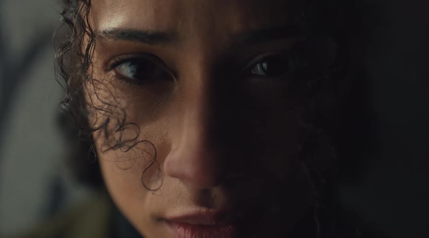 Closeup of a woman face with intense eye contact