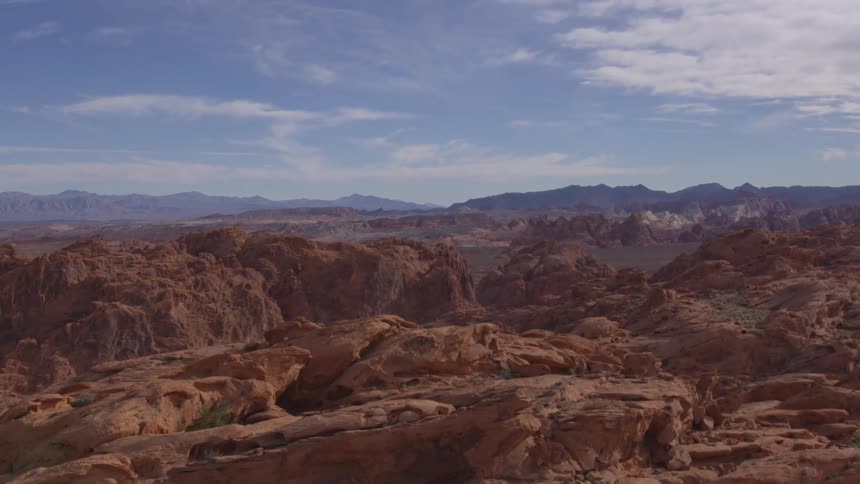 A canyon with a large mass of rugged ridge rocks midday