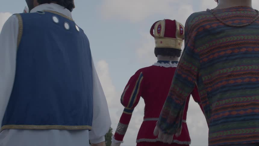 Giant puppets dressed in colorful costumes at a cultural event
