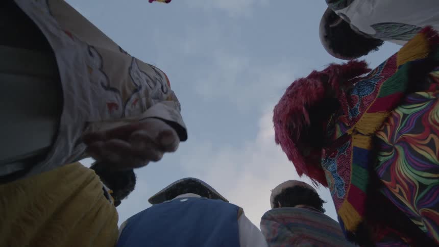 Group of people in colorful costumes and masks