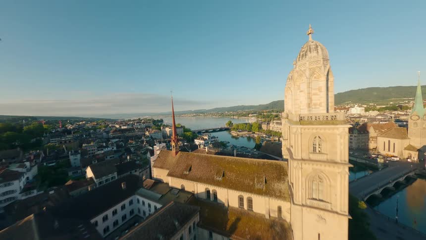 Aerial view of a european city with a large cathedral and river at sunset
