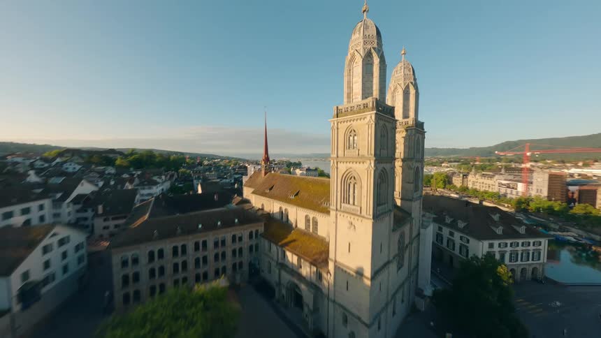 Church and cathedral stand on opposites banks of a channel in a residential neighborhood