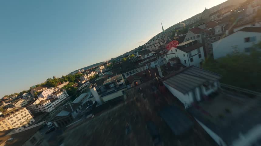 A cityscape in a residential neighborhood with a canal running through it at sunrise