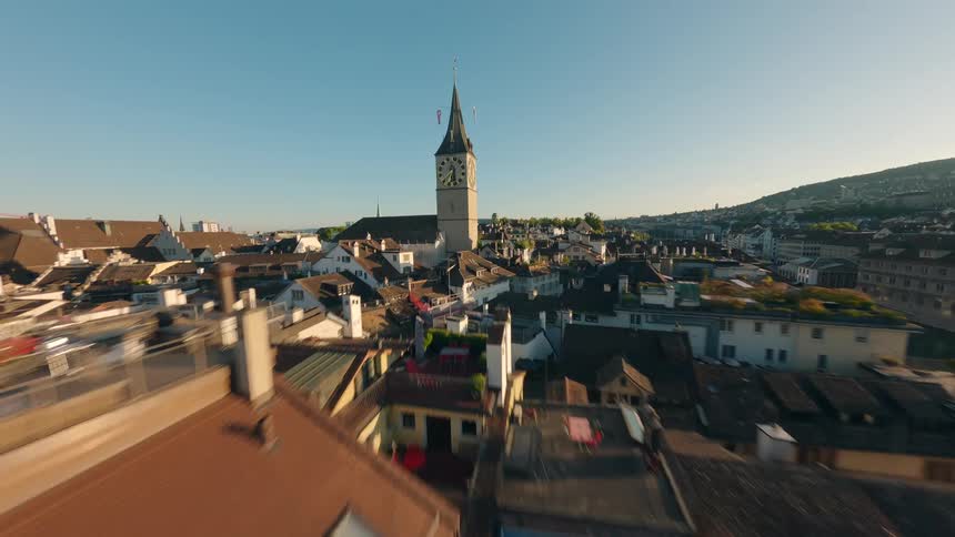 Aerial view of a european city with a church and a river crossed by a bridge