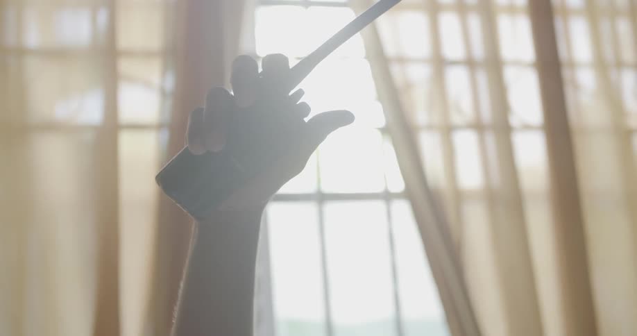 A Person is Holding Up a Walkie-Talkie