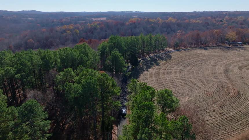 The car drives down the road on the landscape
