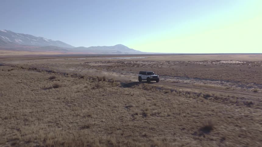 The sports utility vehicle is driving off road