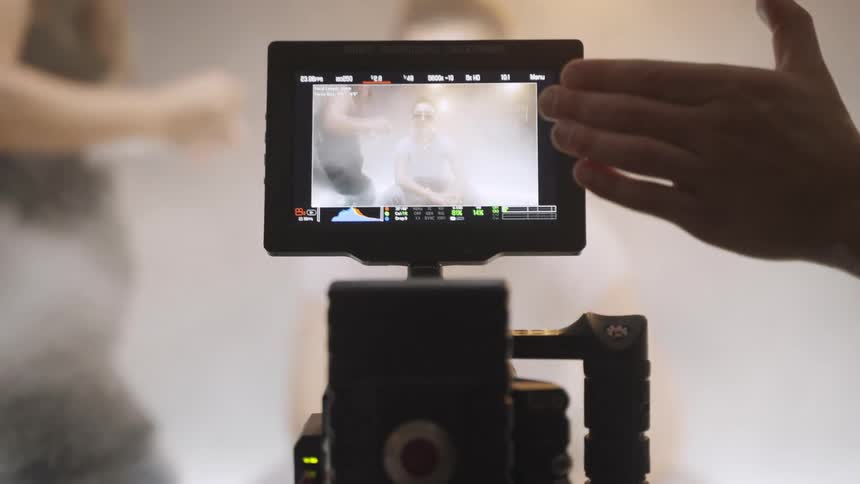 Scene being adjusted through a film camera monitor